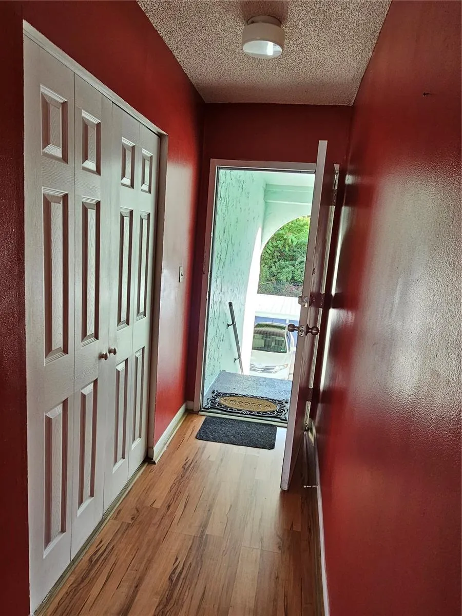 Front door leading to the Living room.Closet on the right side.