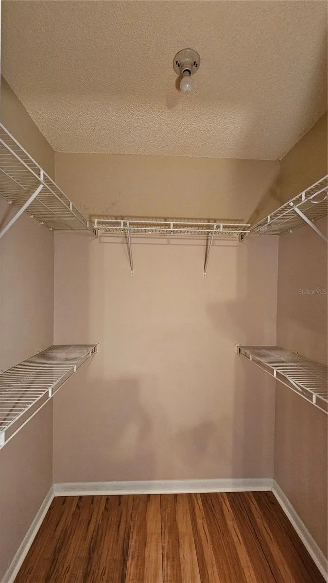 Primary Bedroom walk-in closet