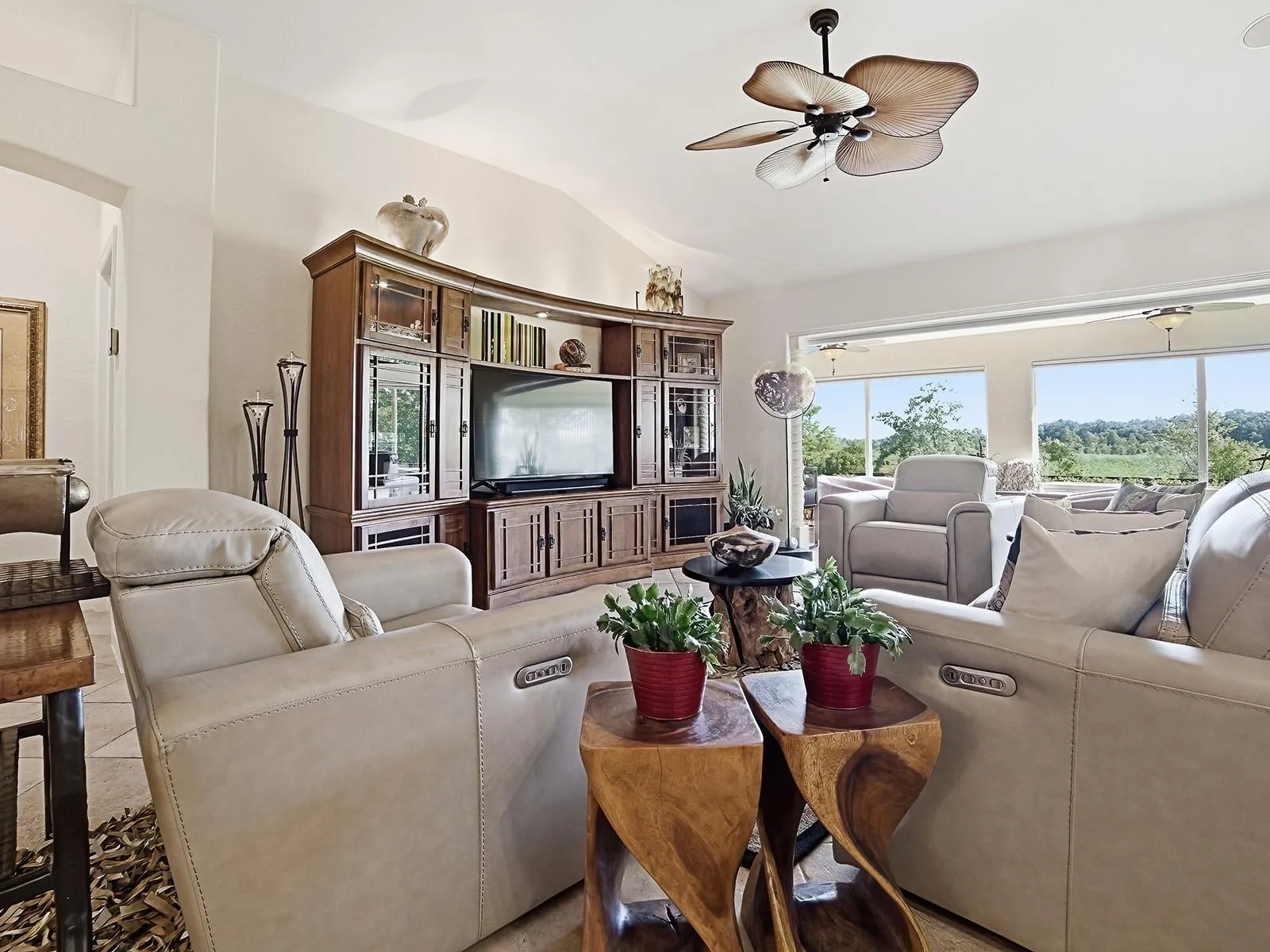 LIVING ROOM AREA WITH VIEWS TO THE ENCLOSED LANAI