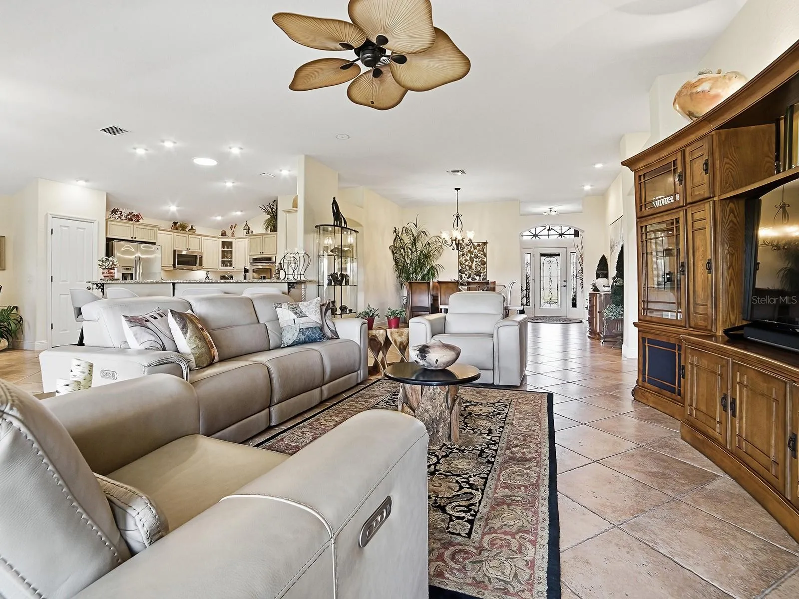 VIEW TO THE OPEN KITCHEN, DINING ROOM, AND THE FRONT FOYER