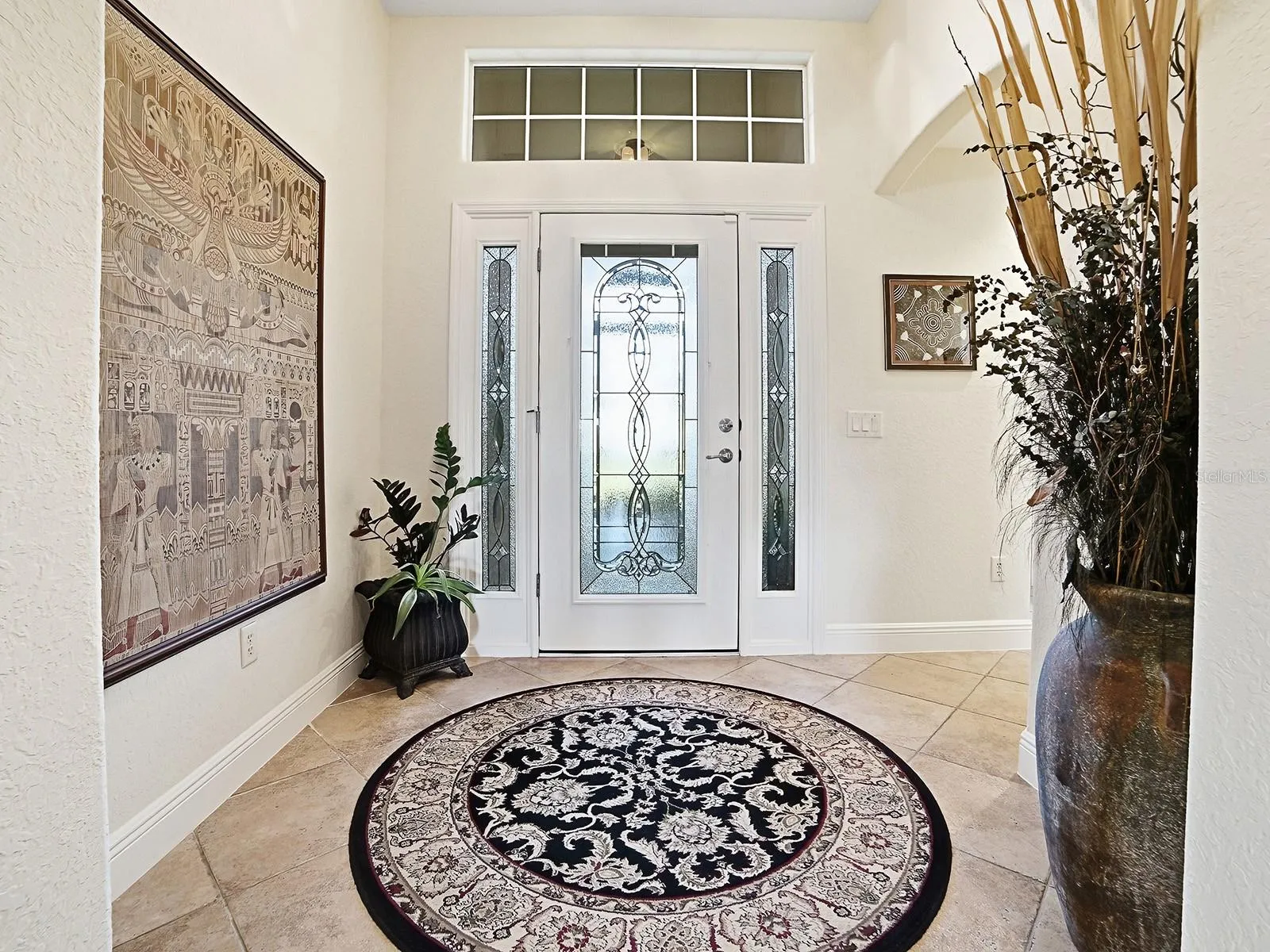 YOUR GRAND ENTRYWAY WITH NATURAL LIGHT AND LEADED GLASS DOOR