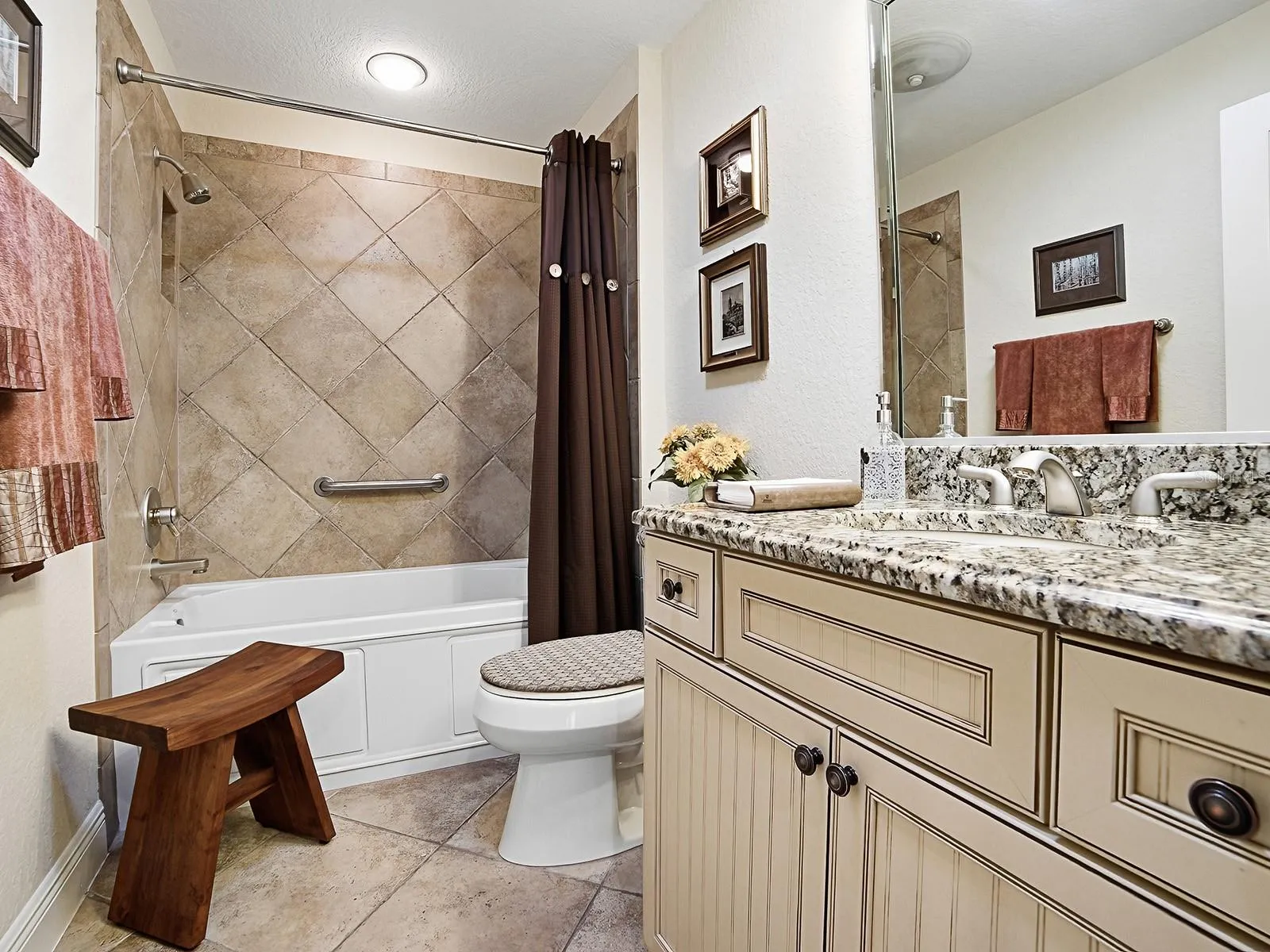 GUEST BATHROOM WITH TILE SHOWER/BATH COMBO