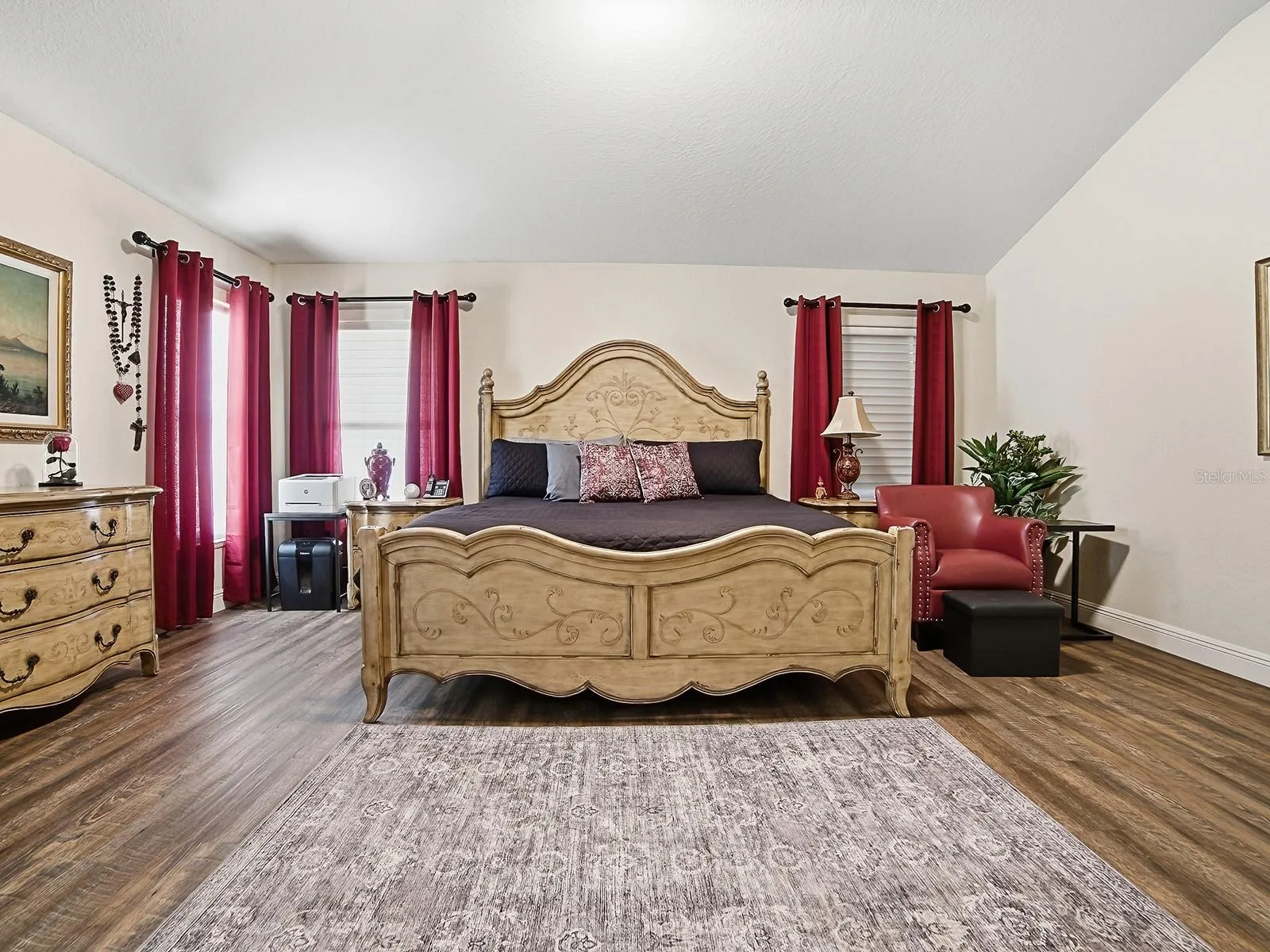 YOUR PRIMARY BEDROOM WITH HARDWOOD FLOORING