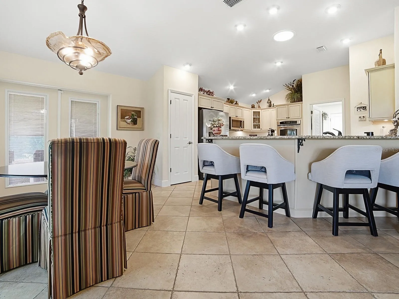EAT IN KITCHEN AREA AND BREAKFAST BAR WITH VIEW TO KITCHEN