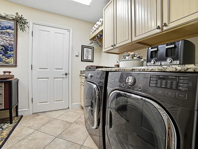 SPACIOUS LAUNDRY ROOM WITH HIGH END WASHER/DRYER