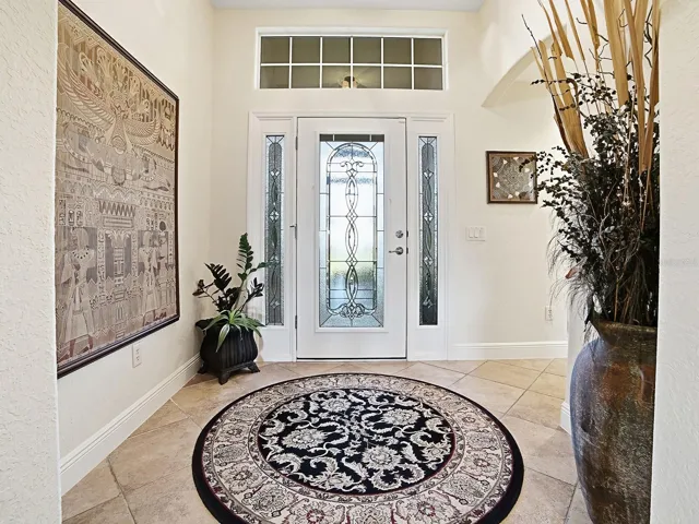 YOUR GRAND ENTRYWAY WITH NATURAL LIGHT AND LEADED GLASS DOOR