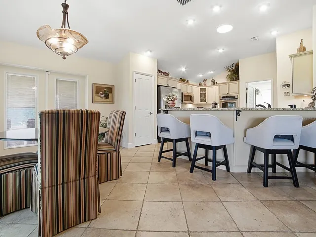EAT IN KITCHEN AREA AND BREAKFAST BAR WITH VIEW TO KITCHEN