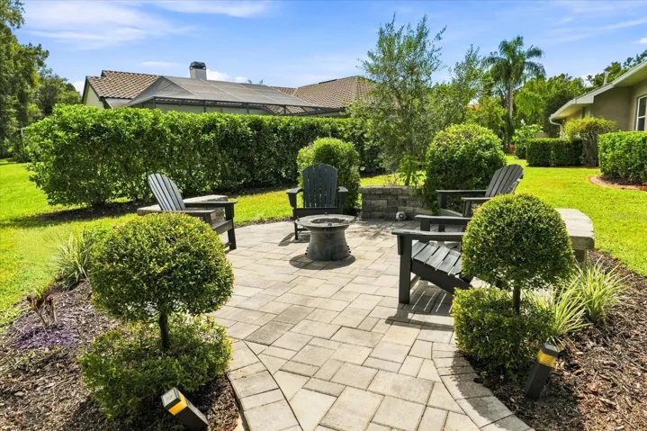 Wood Firepit Patio and Privacy Hedge