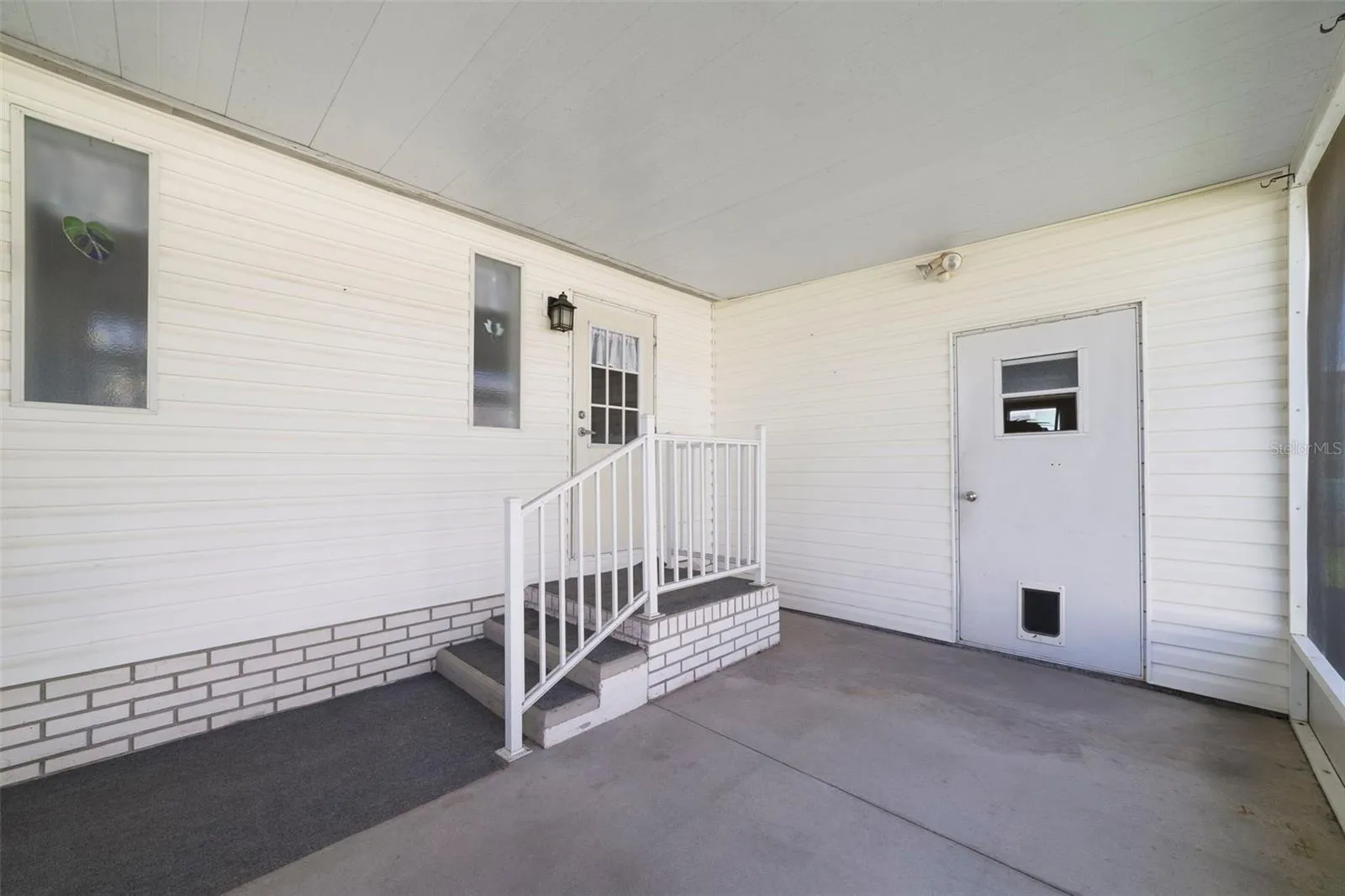 A SCREENED SIDE LANAI offers additional outdoor living space along with convenient STORAGE.