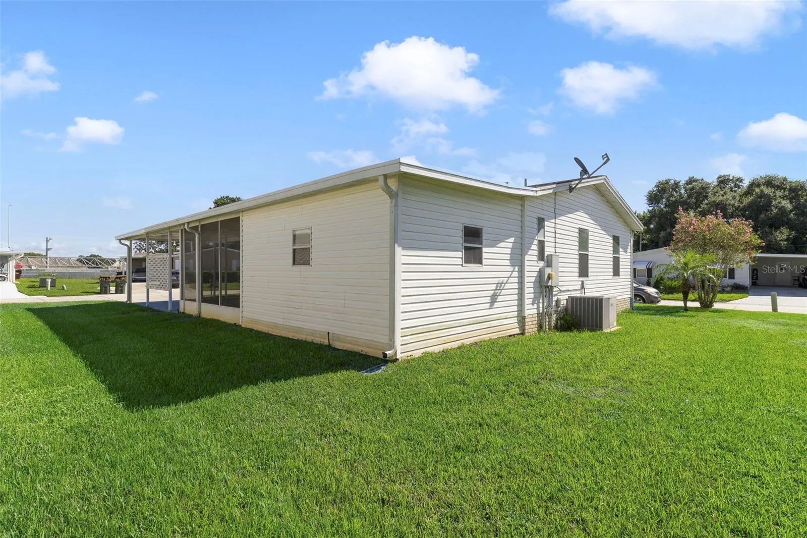 Major updates include a ROOF REPLACED approximately 8 years ago, NEW ROOF over the front lanai and carport (2025), NEW WATER HEATER (2021) and NEW AC (2020), giving you peace of mind while you settle in and make the home your own.