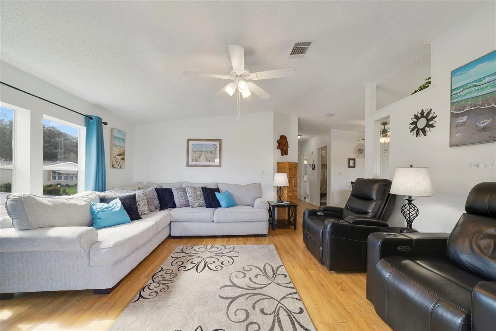 Inside, the home feels bright and sunny, with an OPEN CONCEPT floor plan bringing the Living Room, Dining Area and Kitchen together.