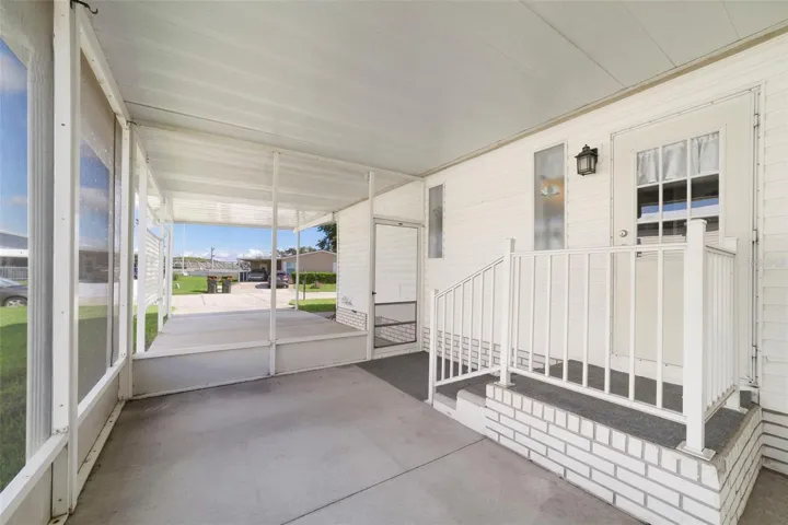 A SCREENED SIDE LANAI offers additional outdoor living space along with convenient STORAGE.