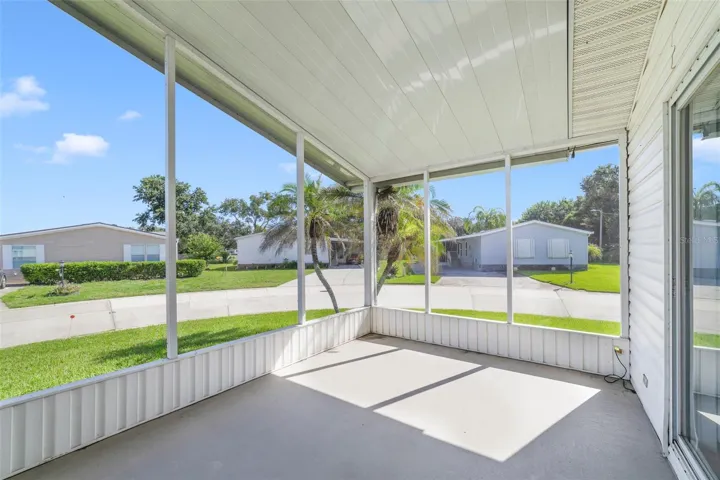 A SCREENED FRONT PORCH welcomes you home and provides a comfortable spot to enjoy your morning coffee or visit with neighbors.