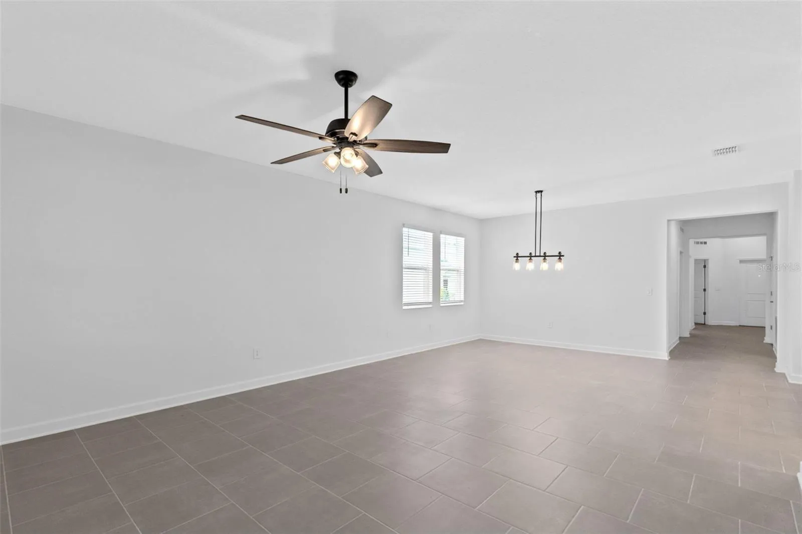 The dining and living spaces flow together beautifully, creating plenty of room for both everyday living and entertaining.