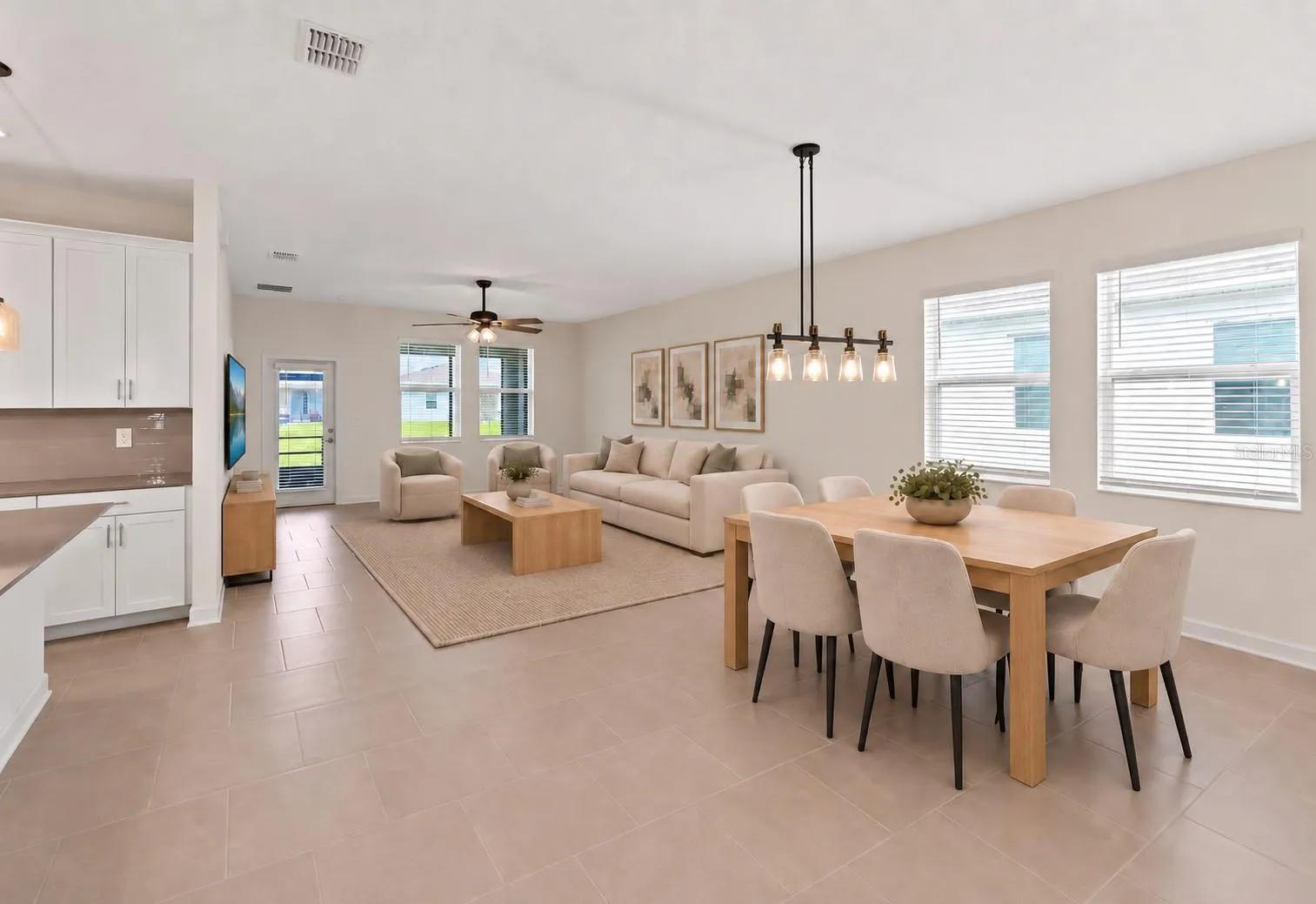 The open kitchen, dining and living spaces flow together beautifully, creating plenty of room for both everyday living and entertaining.