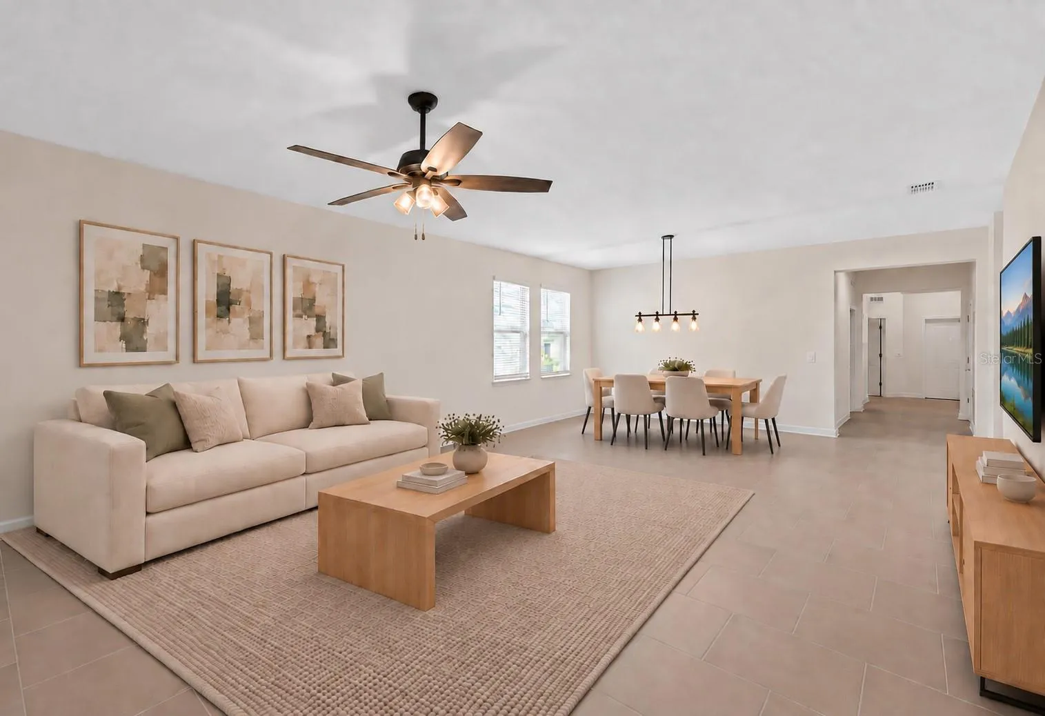The dining and living spaces flow together beautifully, creating plenty of room for both everyday living and entertaining.
