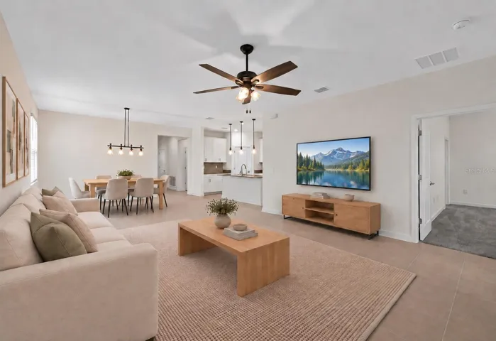 The open kitchen, dining and living spaces flow together beautifully, creating plenty of room for both everyday living and entertaining.