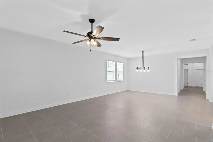 The dining and living spaces flow together beautifully, creating plenty of room for both everyday living and entertaining.