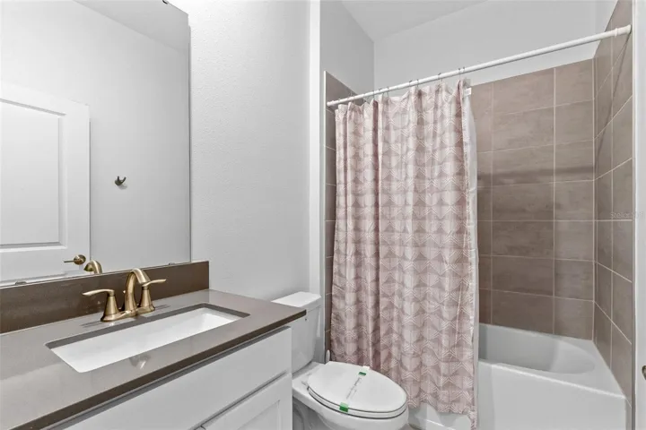 Guest room, full bath, quartz vanities.