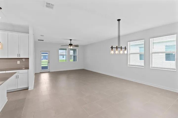 The open kitchen, dining and living spaces flow together beautifully, creating plenty of room for both everyday living and entertaining.