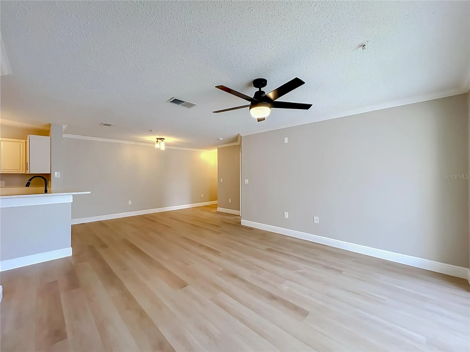 Living Room with lake at your back.  Open and bright