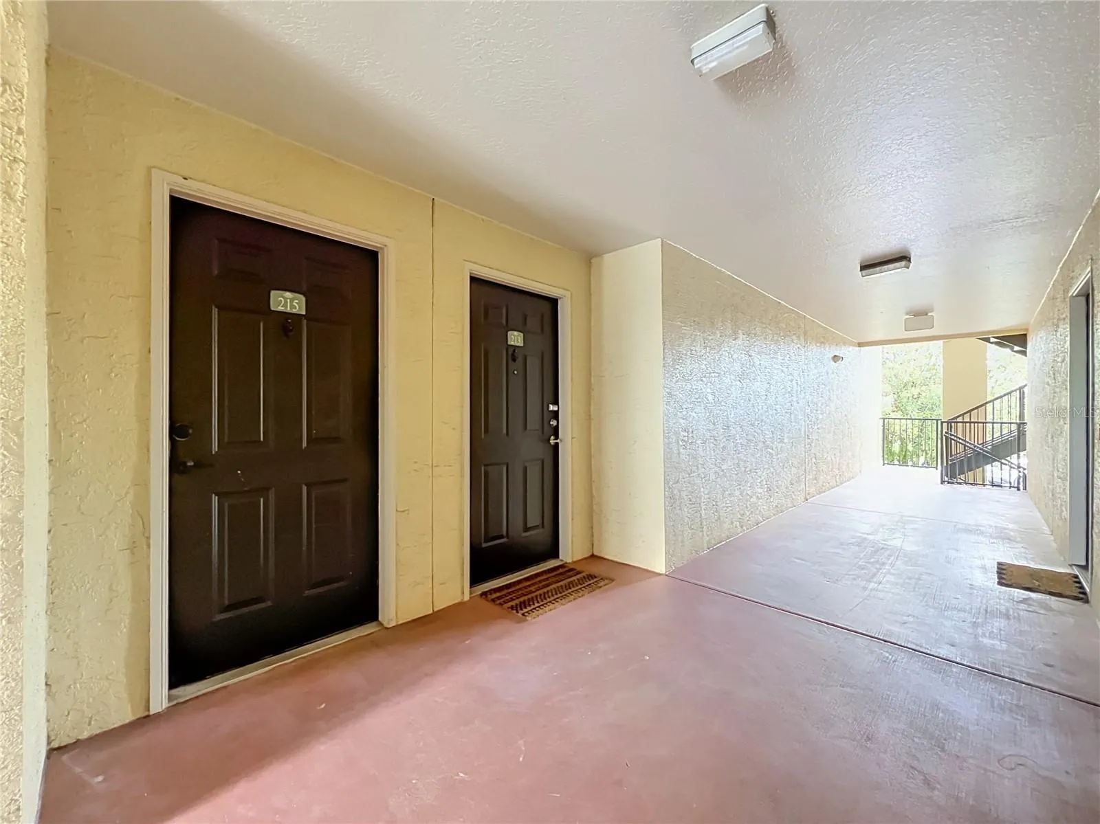 Entrance with exists back to the lake and to the front parking area.