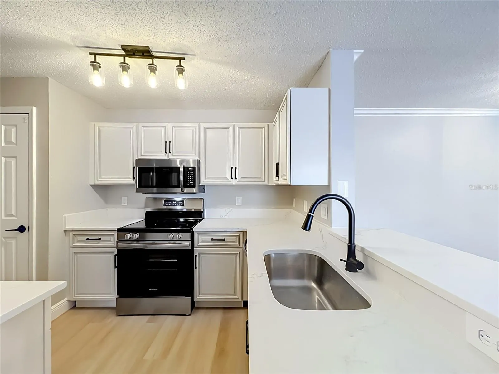 Kitchen with new appliances and countertop
