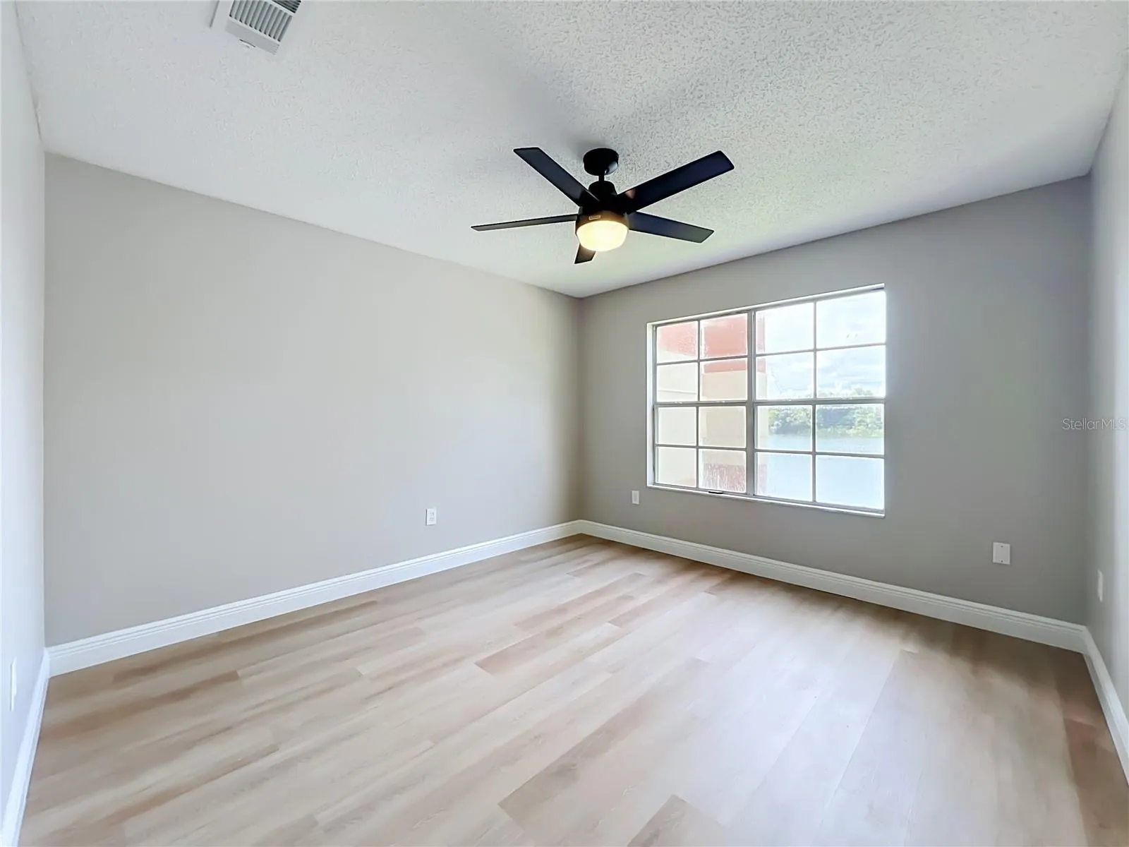 Large Primary Bedroom facing the lake