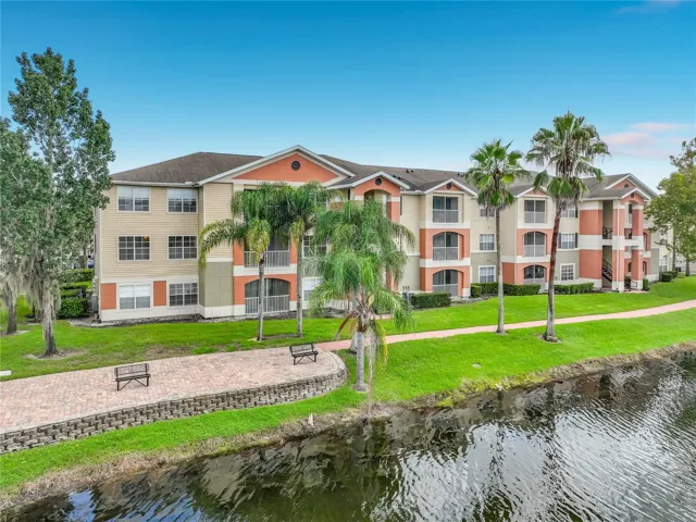 View of your corner unit overlooking the lake, benches and walking path