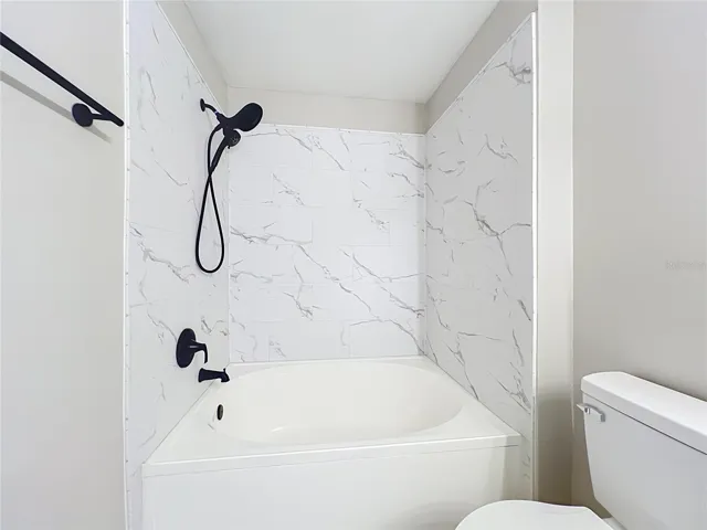 Bathroom 2 with beautifully done new tile.
