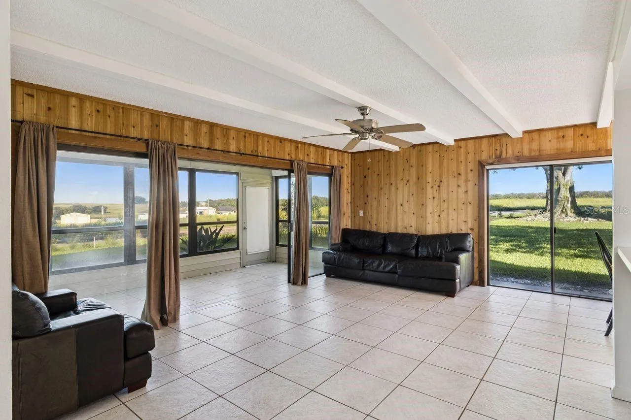 Spacious living room that opens onto Florida room