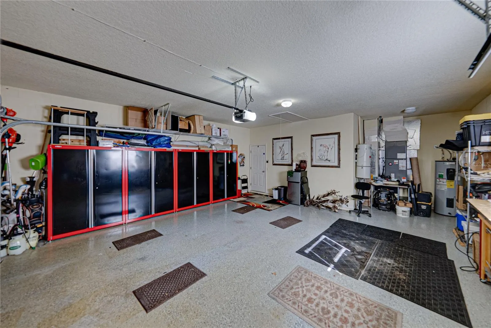 The alcove at the north end of the garage holds the whole house vacuum system.