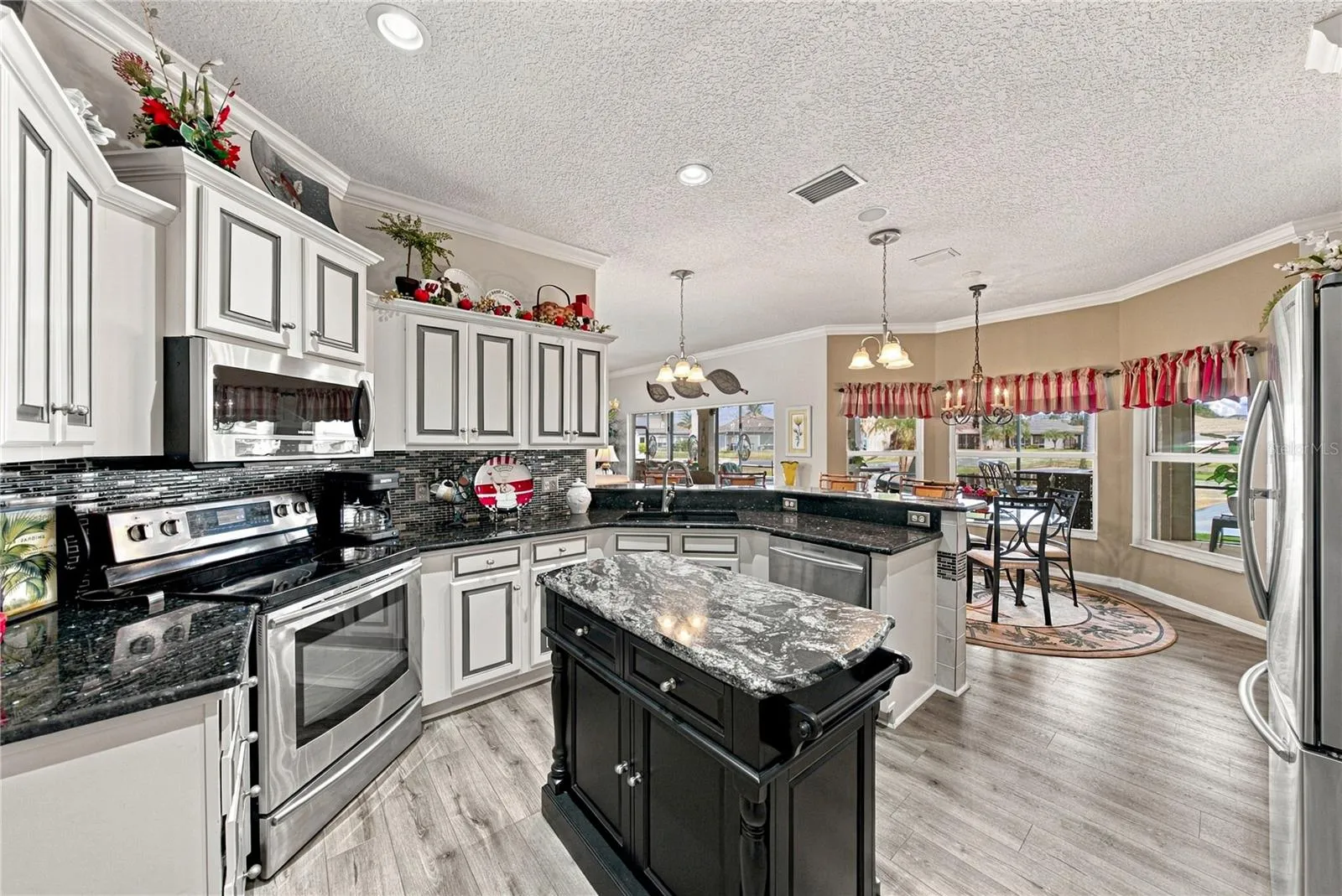 The ample cabinetry with crown molding on top provides desirable storage options.