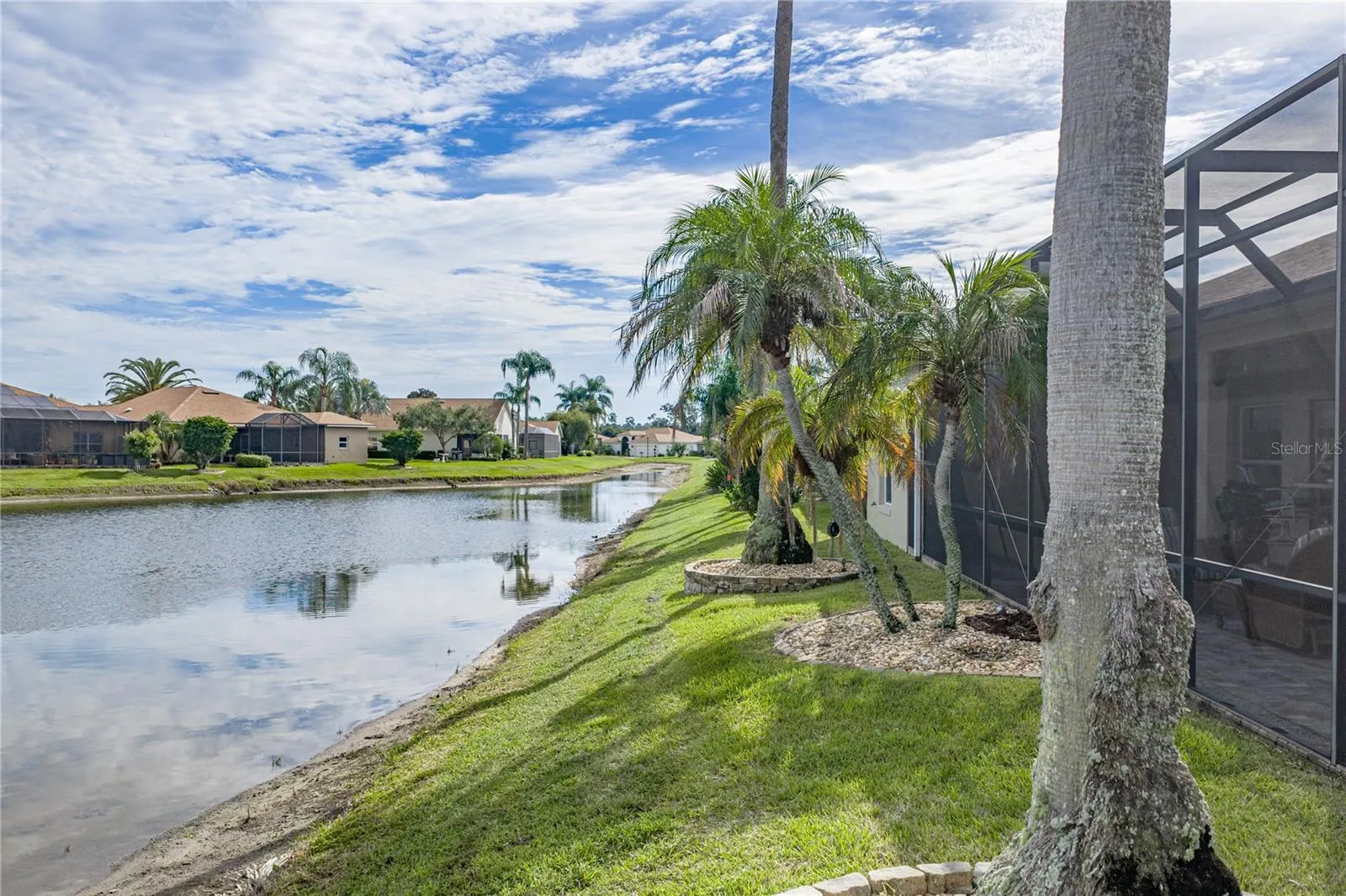 The pond extends to the east of this home.