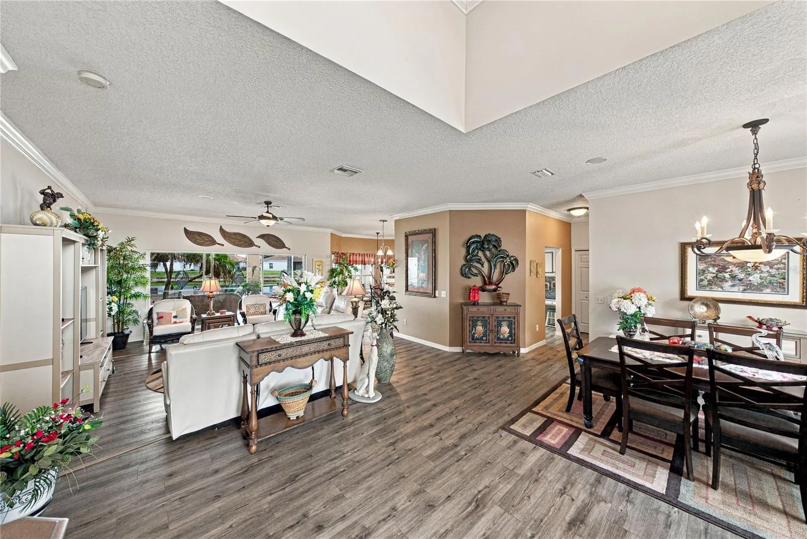 This view from the foyer shows the efficiency of the home's layout from the foyer to the dining room to the living room to the kitchen and dinette.