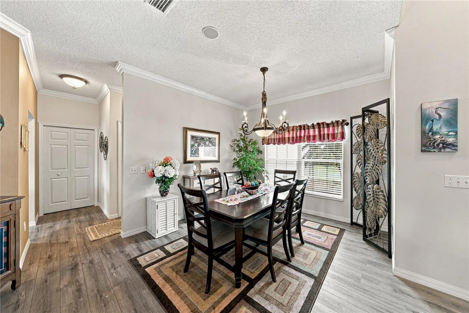 The flexibility of the dining room makes entertaining easy! The large closet pantry is in the background on the left.