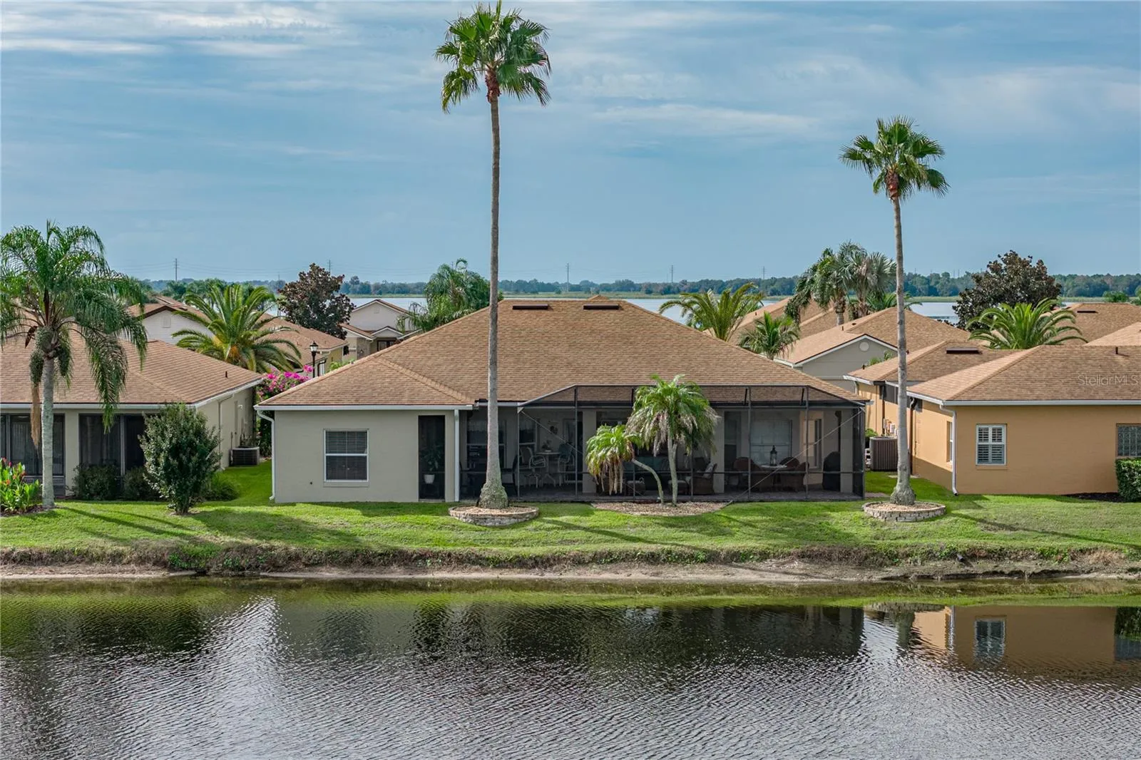 The tall palms at the rear of the home give the true Florida vibe.