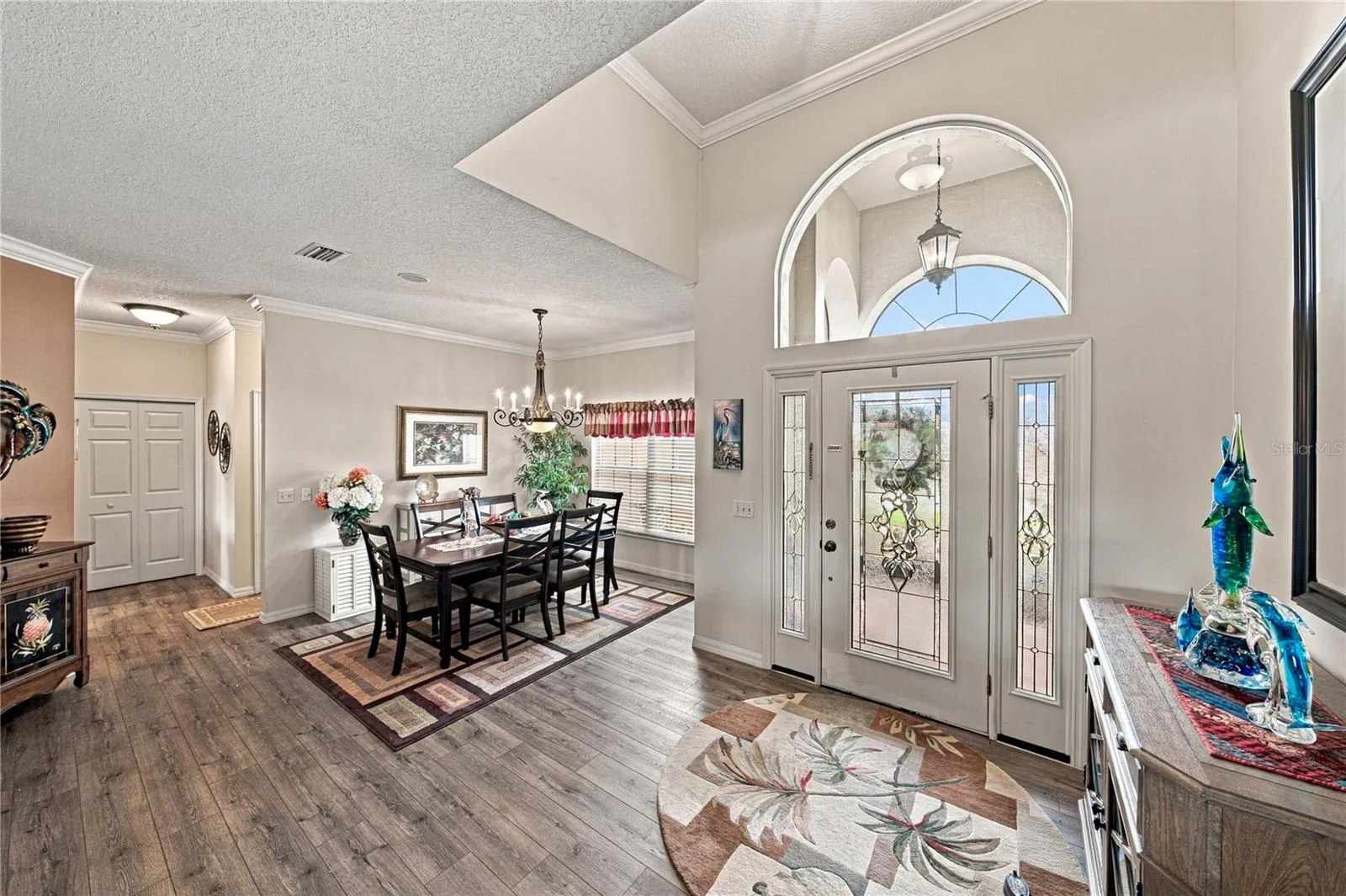 The vaulted ceiling helps to define the welcoming foyer.