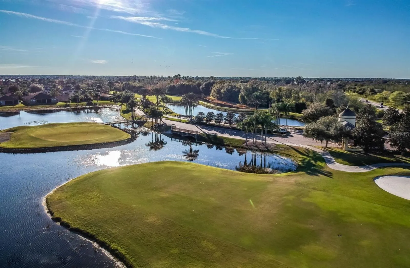 Lake Ashton has 2 par 70 private courses that residents can join. A variety of membership options exist. This is a view of the East Course's signature par 4 island green hole.