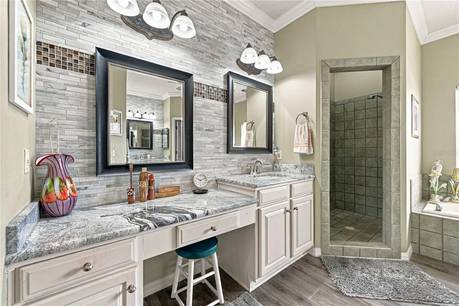 The primary bath has been recently remodeled and features separate vanities.
