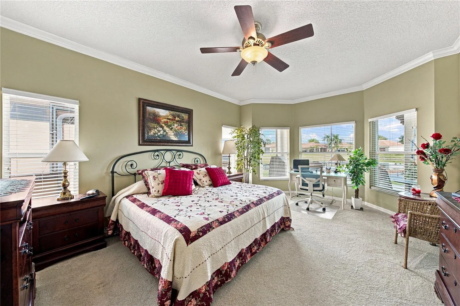 The primary suite fills the entire west wing. The primary bedroom has a bay window area.