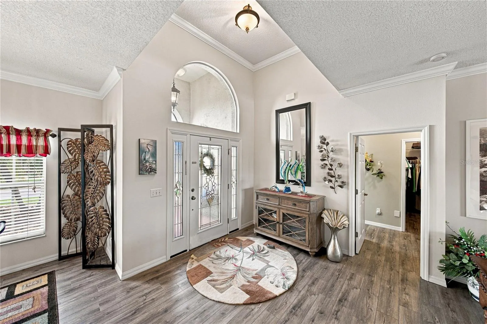 This split floor plan home has the primary suite filling the entire west wing of this home. The doorway is visible on the right.