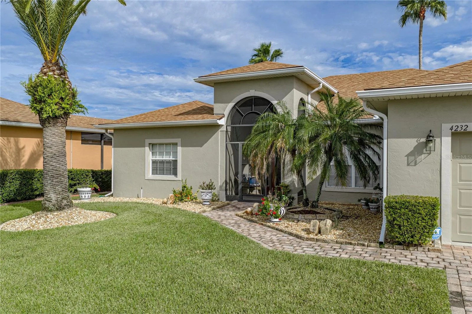 The stone mulch, paver walk and driveway add to the curb appeal.