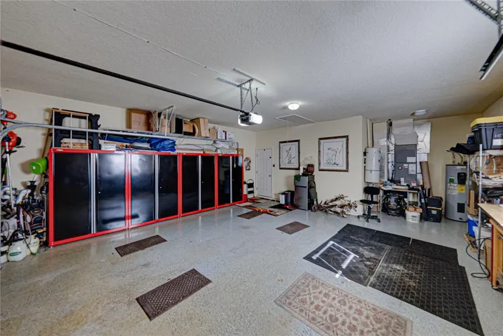 The alcove at the north end of the garage holds the whole house vacuum system.