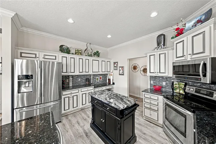 The newer stainless-steel appliances and prep island are pluses!