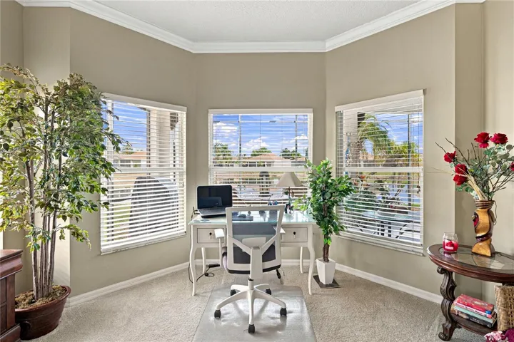 The bay window area in the primary bedroom offers a great view of the pond behind.