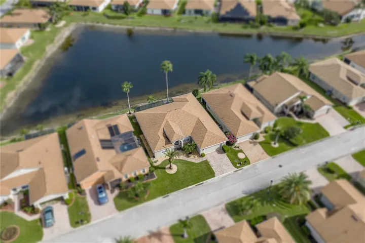 The home abuts a large pond.