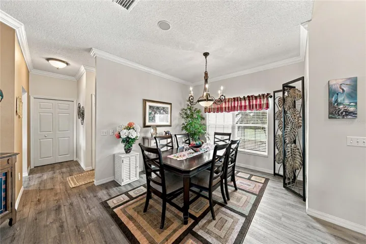 The flexibility of the dining room makes entertaining easy! The large closet pantry is in the background on the left.