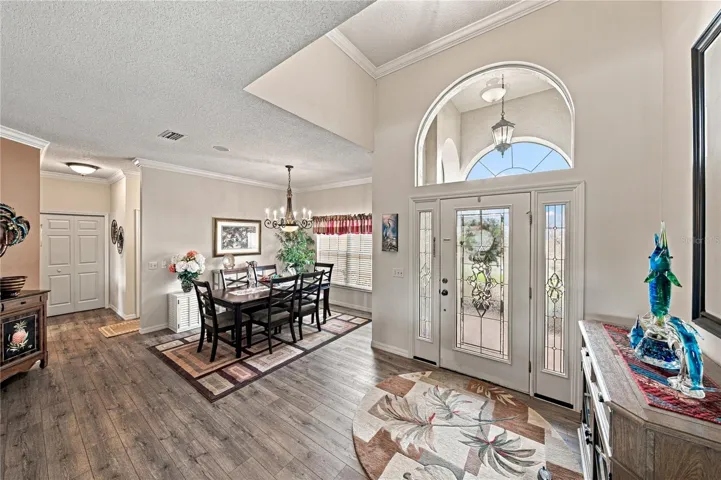 The vaulted ceiling helps to define the welcoming foyer.