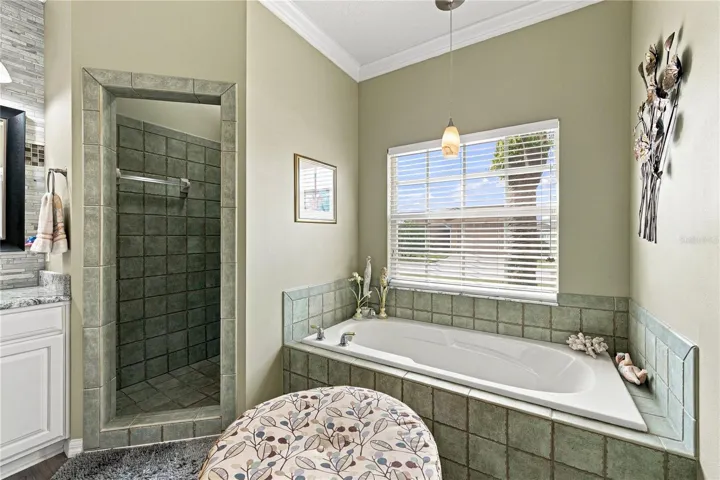 The ample stall shower and garden tub offer options for quick or leisurely.